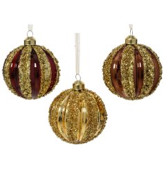 Craft a festive glow with this elegant collection of ribbed glass ornaments.