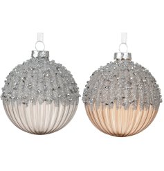 Enhance your holiday decor with beautiful gold and silver glass baubles for a festive touch.