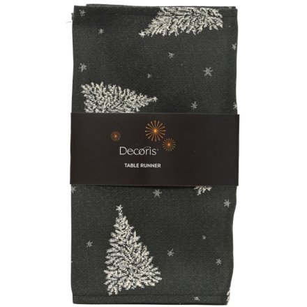 Enhance your dining space with this stylish tree-patterned table runner.