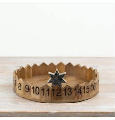 Advent tray featuring numbered sections around the edge and a metal star marker to track the days until Christmas