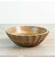 Add rustic charm to your home with this handcrafted carved mango wood bowl showcasing natural texture.