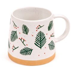 Enjoy your favorite brew in this charming Pine Sprigs & Berries stoneware mug