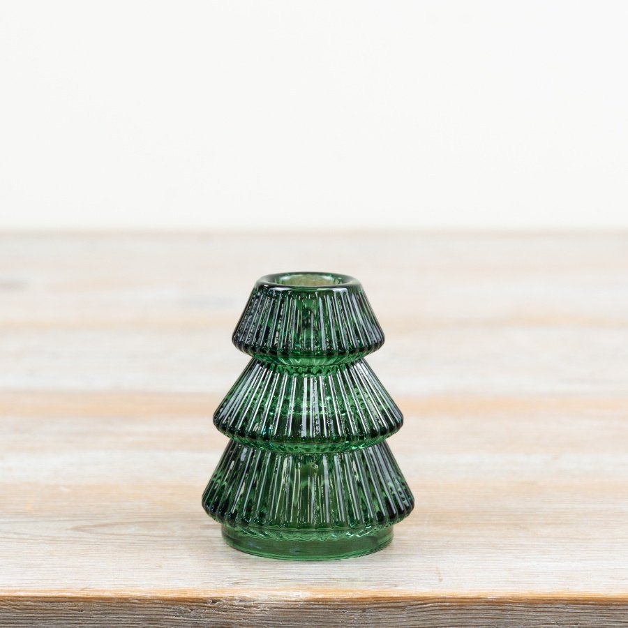 Elegant dark green glass taper candle holder to create a cosy, traditional ambience