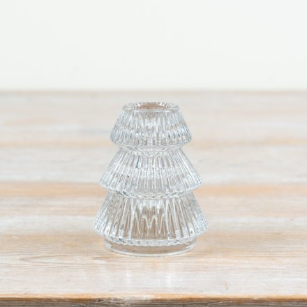 Bring a cozy, sophisticated touch to your seasonal styling with this elegant tree-shaped glass candlestick holder.