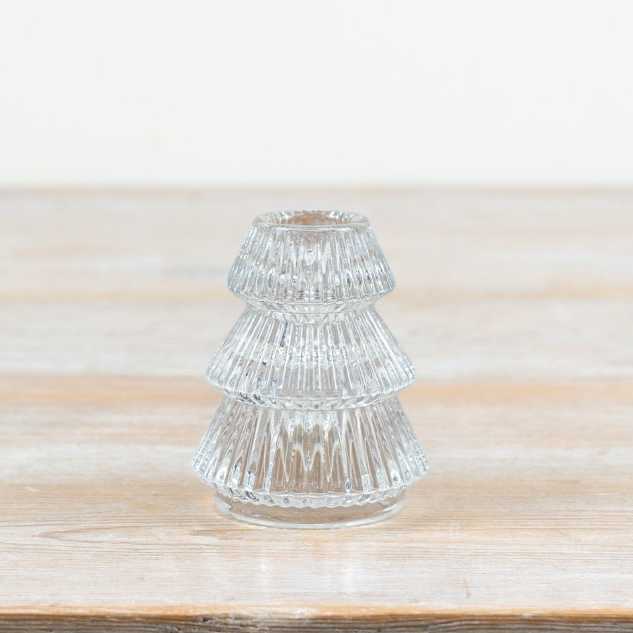 Add a refined, cosy feel to festive displays with this charming tree-shaped glass candle holder