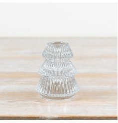 Bring a cozy, sophisticated touch to your seasonal styling with this elegant tree-shaped glass candlestick holder.