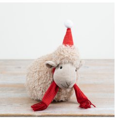 a fun fluffy sheep decoration with a christmas hat 