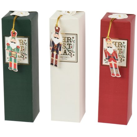 Bring holiday cheer with the Nutcracker Diffuser Glass, available in white, red, or green.