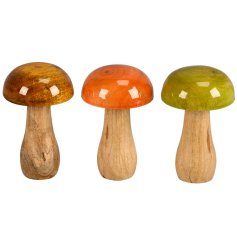 Enhance your space with a charming standing glazed mushroom decoration.