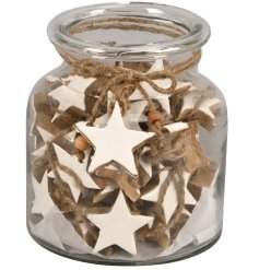 Add a charming touch to your holiday decor with this White Mango Wood Star in a rustic glass jar