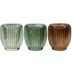 Enhance your space with this stylish green glass candle holder, adding a splash of color and charm.