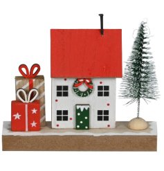 Charming mini house with leafy tree and bright gifts, ideal for adding a cozy touch.