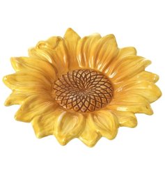 Vibrant yellow plate adorned with a sunflower design.