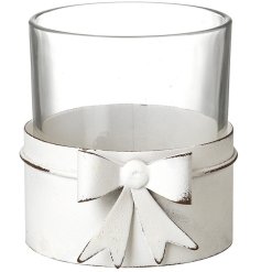Add elegance and warmth to your home with this White Metal Bow T-light Holder