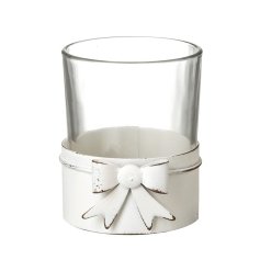 Adorable small white bow tea light candle holder.