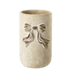 Enhance your space with this stylish White Bow Design Cement Planter.