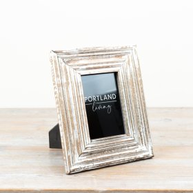 Charming picture frame with a whitewashed finish for a rustic, elegant touch.