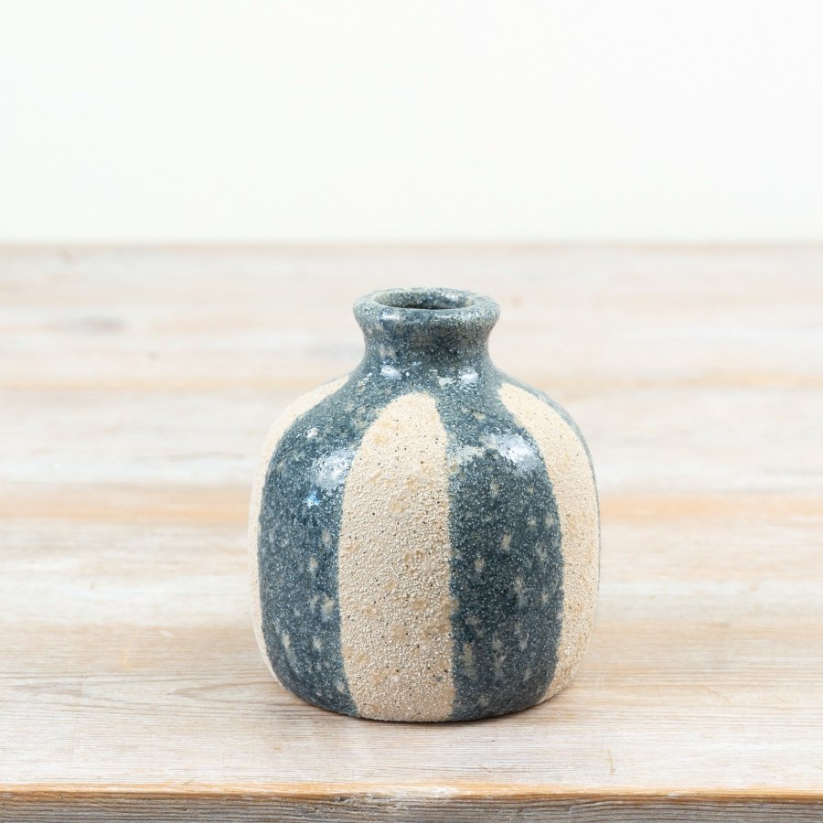 Bring coastal elegance home with this chic Blue and White Ceramic Striped Vase.