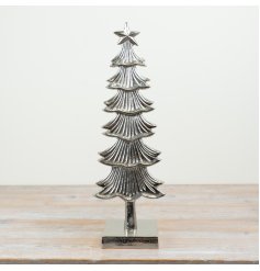 A charming silver patterned tree with star 