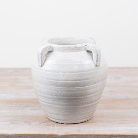 Chic vase with a sleek handle design for elegant decor.