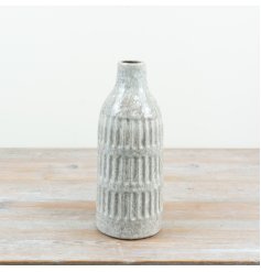 Elevate your space with this elegant slim ceramic vase in a soothing natural shade