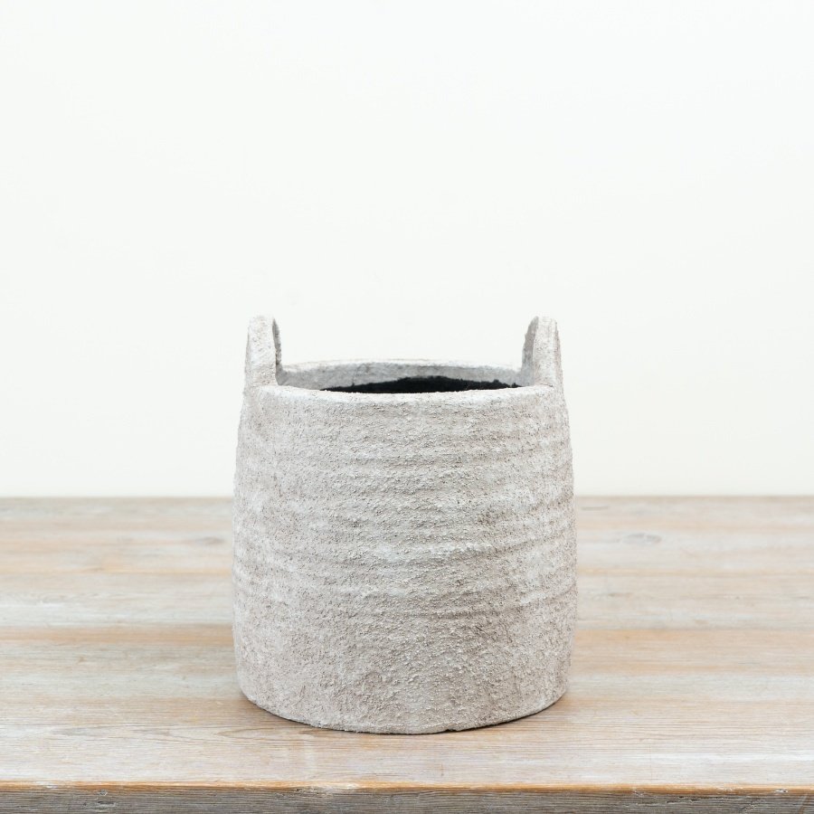a delightful natural planter featuring practical handles