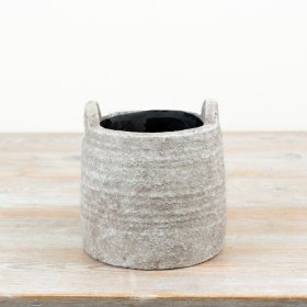 A delightful natural planter featuring convenient handles for effortless relocation
