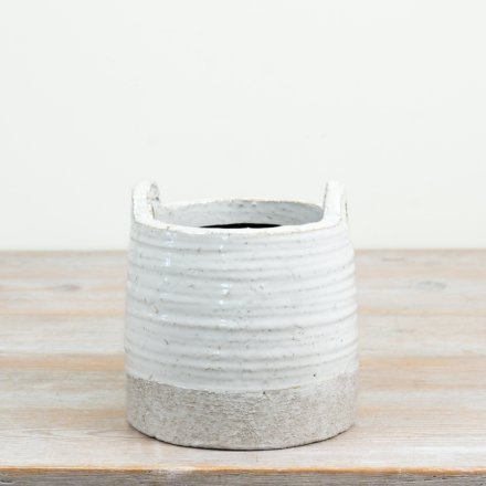 a charming textured and glazed planter with handles 