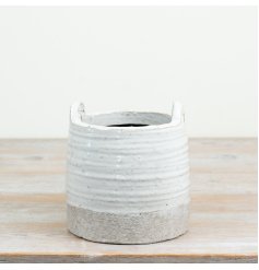 a charming textured and glazed planter with handles 