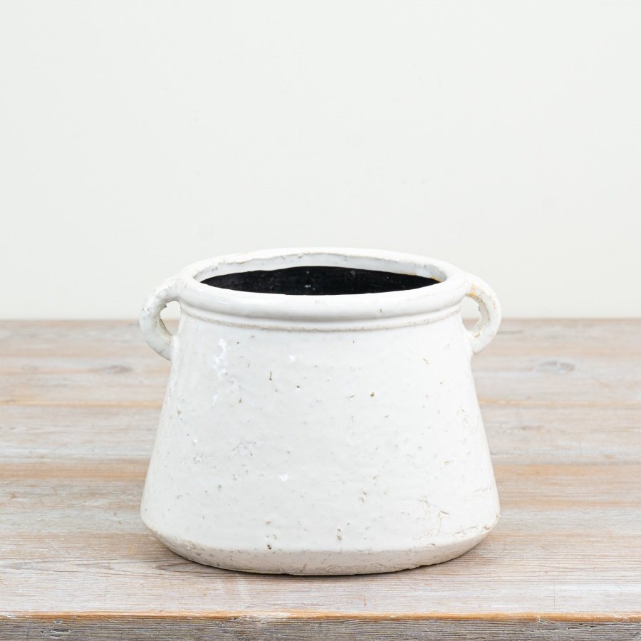 a delightful glazed flower pot with practical handles