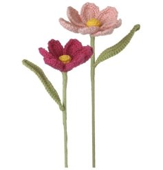A mix of 2 pastel pink crochet flowers in a soft, bright color palette.
