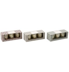 Bring cozy charm to your space with our lovely Gingham votive candles.
