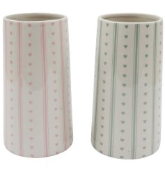Charming pastel vase adorned with stripes and a heart motif to brighten any space