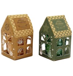 Delightful seasonal candles adorned with detailed tree and snowflake patterns