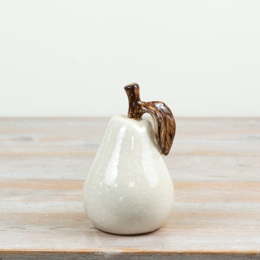 Stylish white ceramic pear with a sleek glazed finish ideal for chic interiors