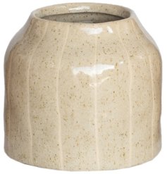 a small glossy lined ceramic vase 
