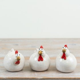 delightful trio of glossy ceramic chickens with playful wide-eyed looks