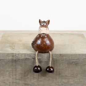 Add a touch of whimsy to any shelf or windowsill with this delightful animal figure