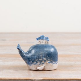Delightful rustic blue whale figure adding a cosy coastal vibe to your interiors