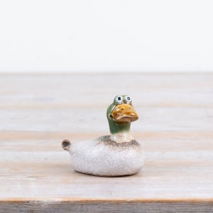 Delightful crested duck figurine crafted in nature-inspired reactive green stoneware