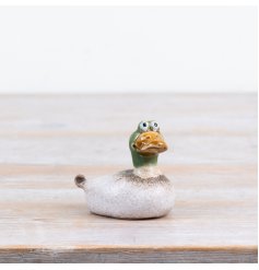Delightful crested duck figurine crafted in nature-inspired reactive green stoneware