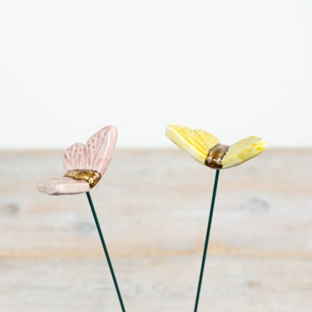 Delight your garden with this charming butterfly stake in vibrant reactive yellow and soft pink