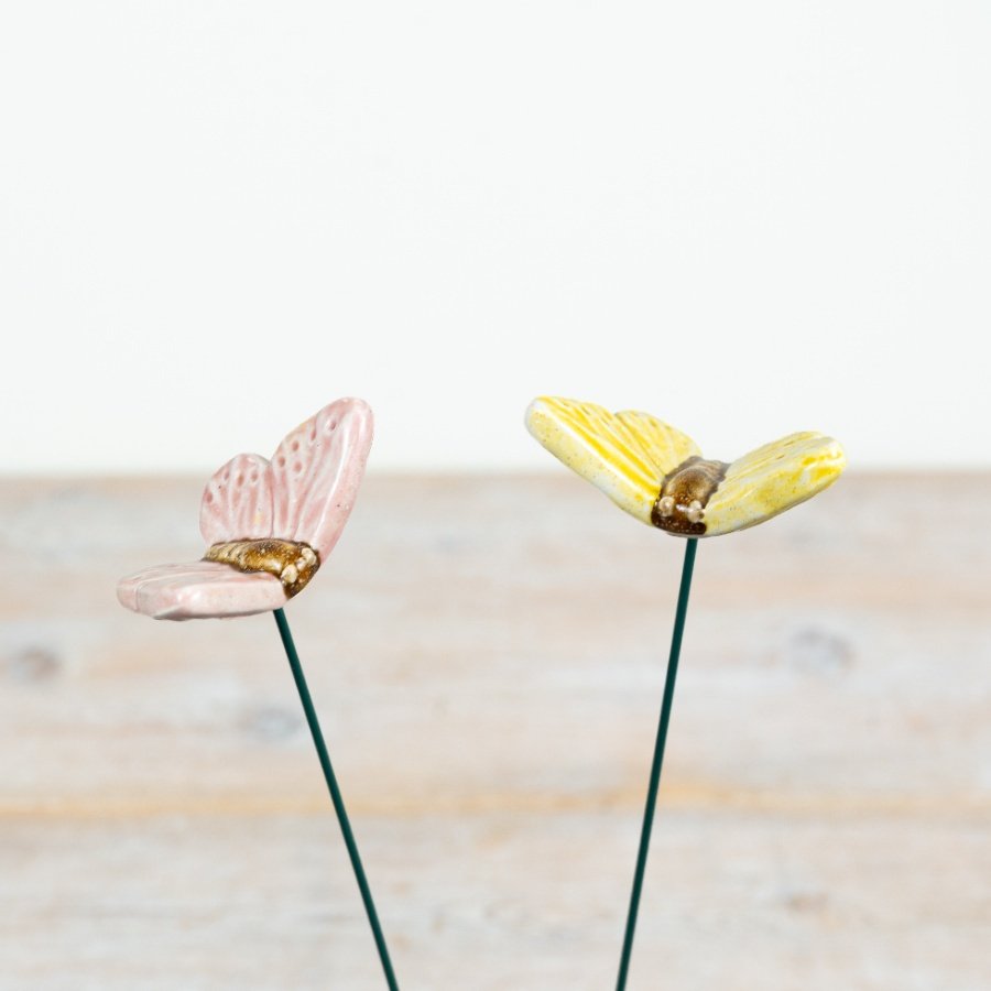 Bring a splash of colour to your garden with these delightful yellow and pink butterfly stakes