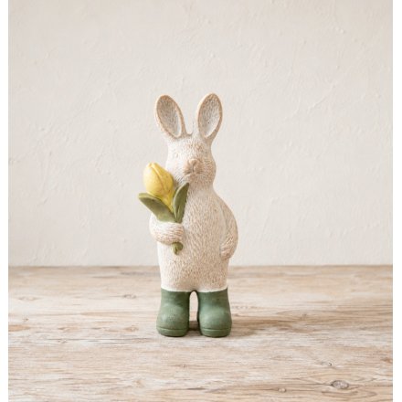 delightful bunny statue with pastel tulip and yellow boots