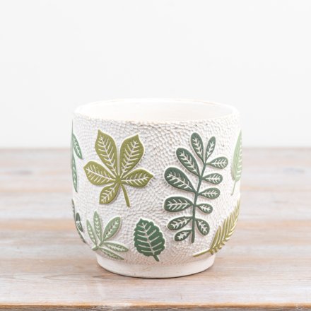 An elegant ceramic plant pot embossed with leafy designs, perfect for plant enthusiasts