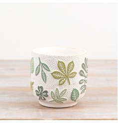 Invite a hint of greenery inside with this delightful green leaf ceramic planter pot