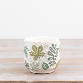 Introduce peaceful greenery indoors with this charming leaf-patterned plant pot