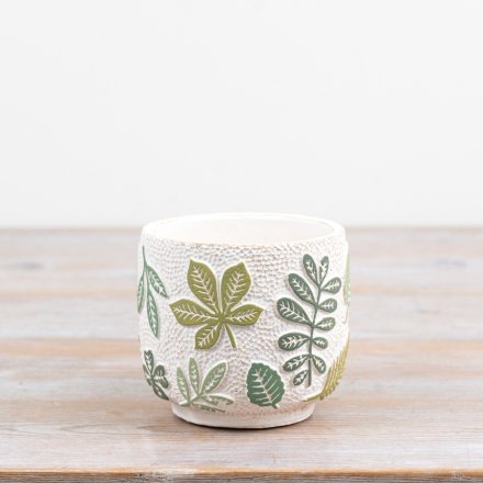 Brighten your space with this nature-themed plant pot showcasing graceful green leaves