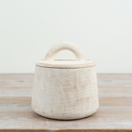 Add subtle texture and functional organisation to your home with this lidded pot 