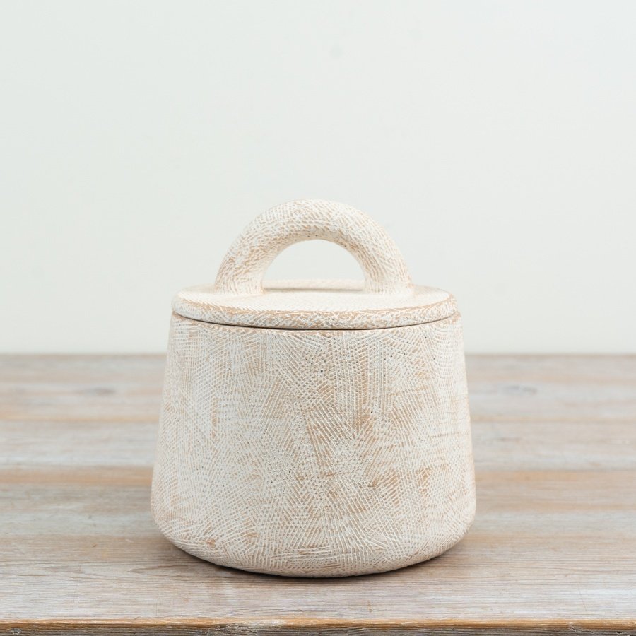 Enhance your space with this textured, practical storage pot for everyday organisation